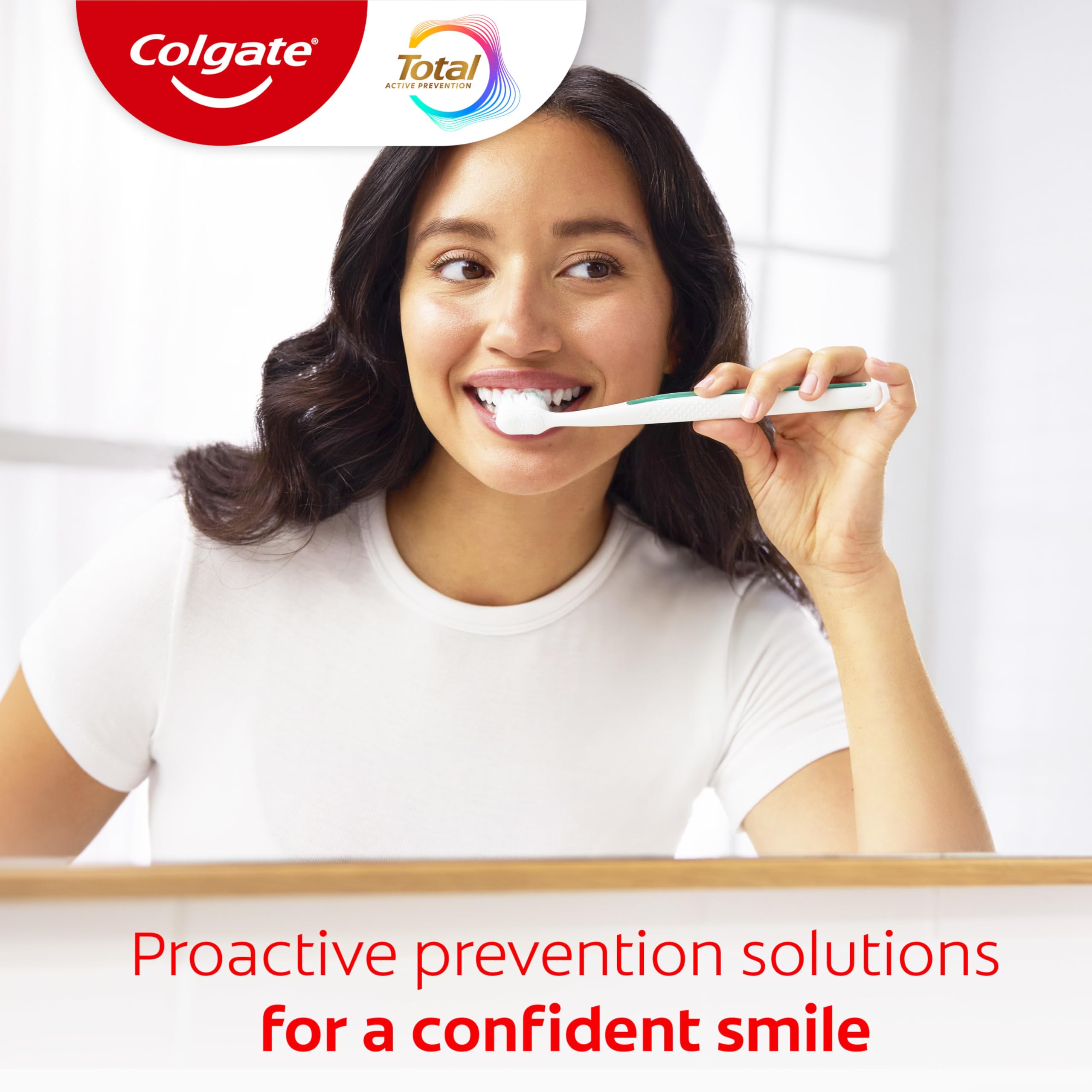 Colgate Total brushing action image illustrating daily brushing routine for gum and enamel care.