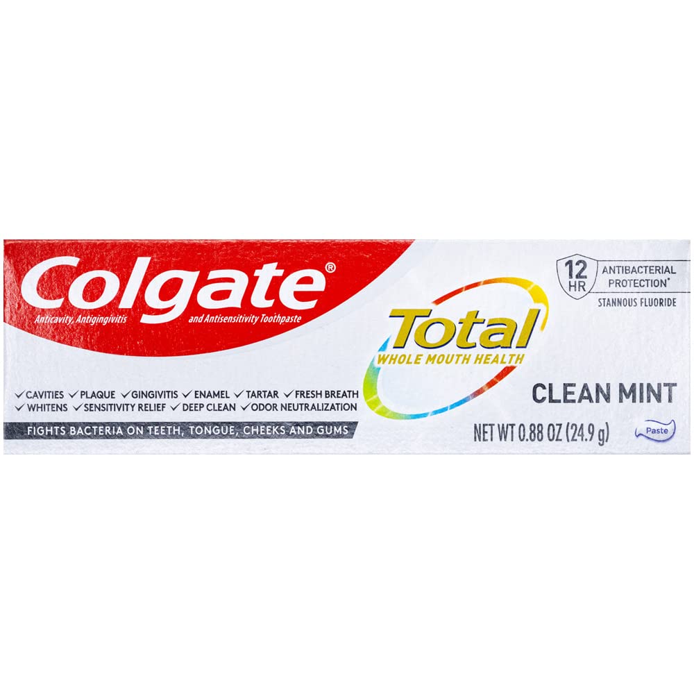 Colgate Total Clean Mint toothpaste tube in hand, ready for travel and fresh breath.