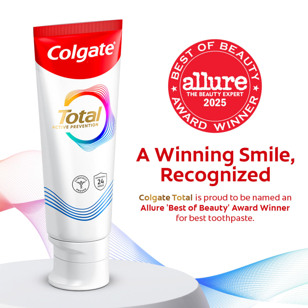 Colgate Total Whitening toothpaste back view showing active ingredients for root-cause protection.