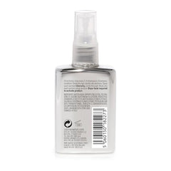 COLOR WOW Dream Coat application showcases even mist for smooth results.
