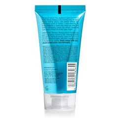 COLOR WOW Money Masque being applied, highlighting creamy texture for deep conditioning.