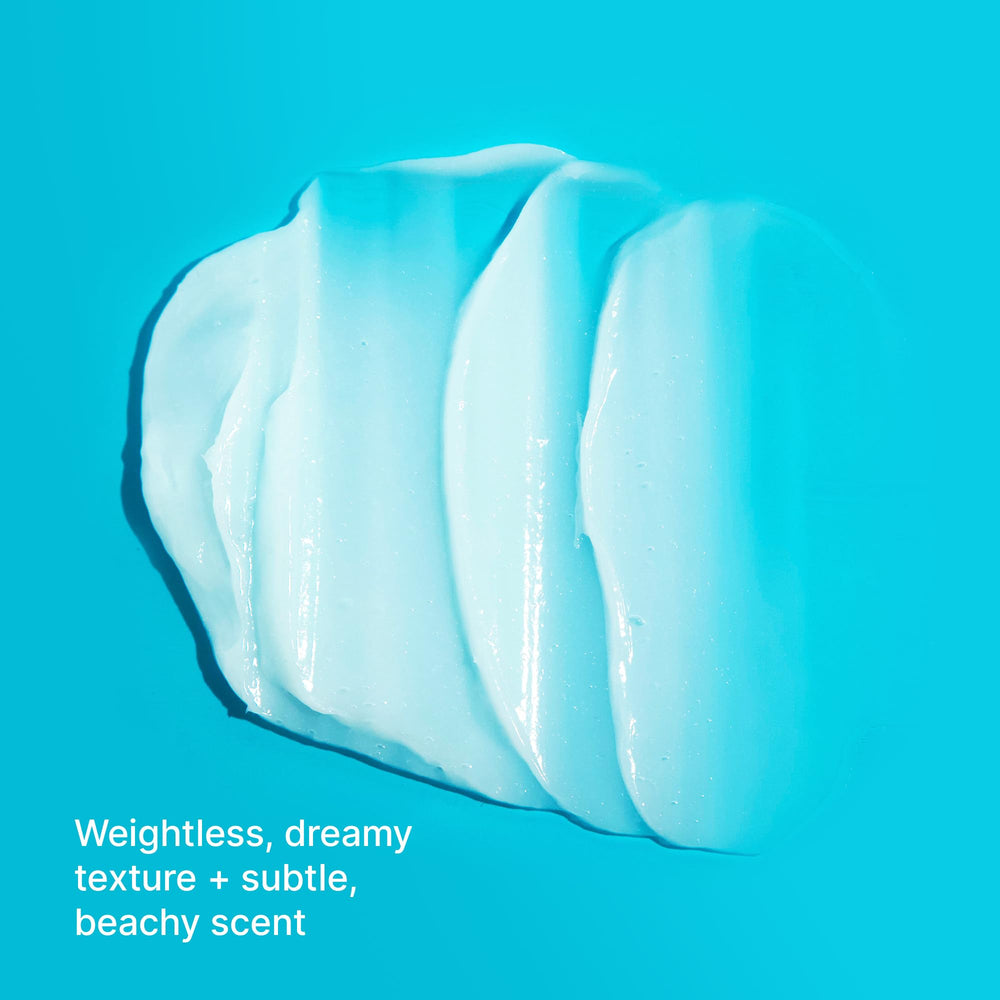 Creamy Money Masque texture on fingertips signaling nourishing conditioning.