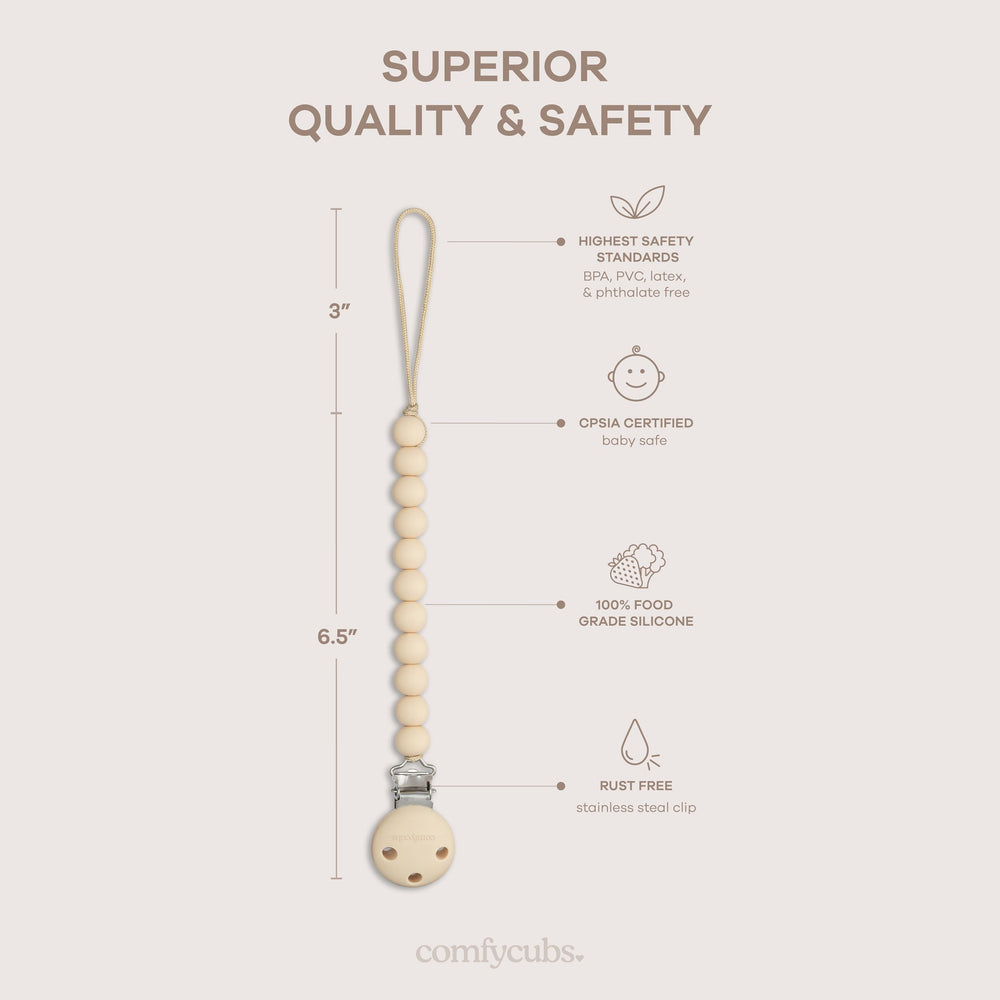 Comfy Cubs pacifier clip attached to baby clothing for quick access