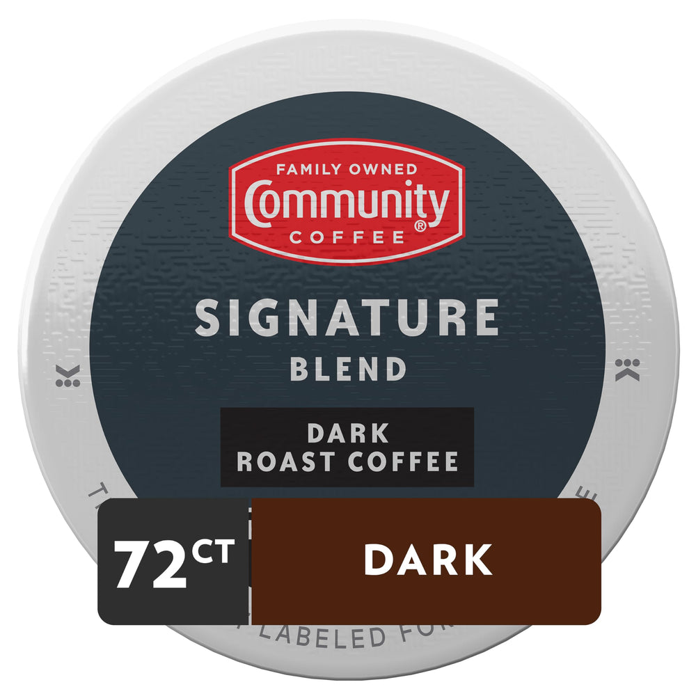 Close-up of Community Coffee Signature Blend pods highlighting the dark roast aroma.