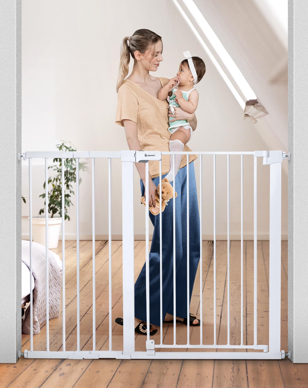 COMOMY 36-inch gate closed with double-lock system for added safety.