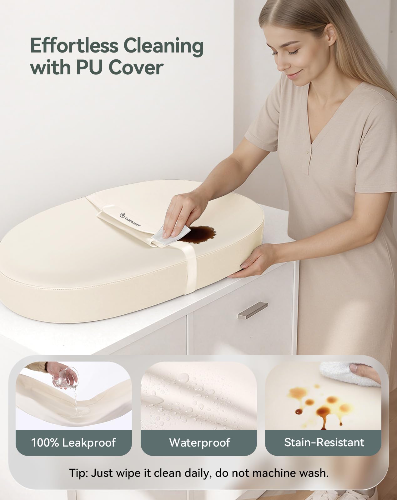 COMOMY changing pad showing contoured wall to prevent rolling during changes