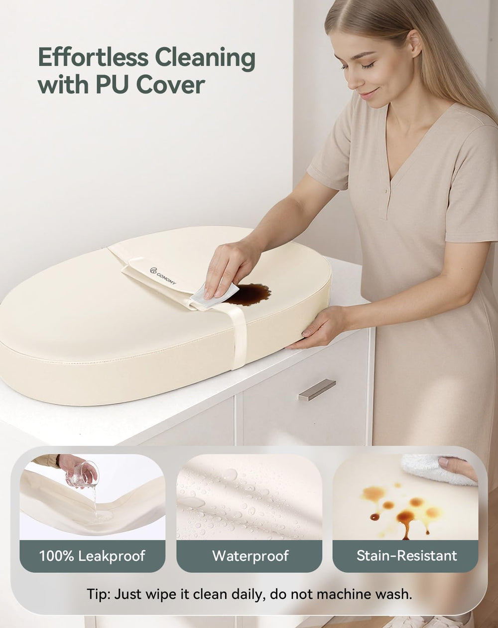 COMOMY changing pad showing contoured wall to prevent rolling during changes
