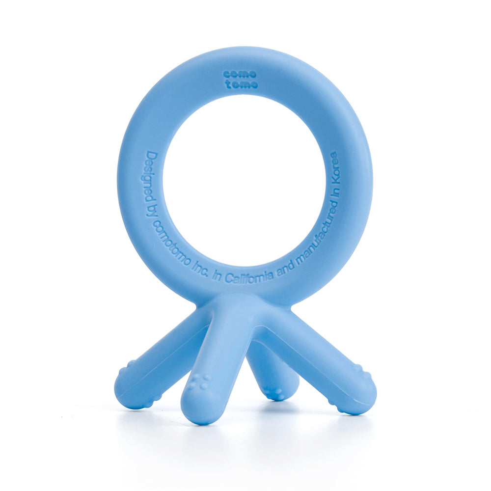 Comotomo silicone baby teether blue finger-sized, easy for tiny hands.