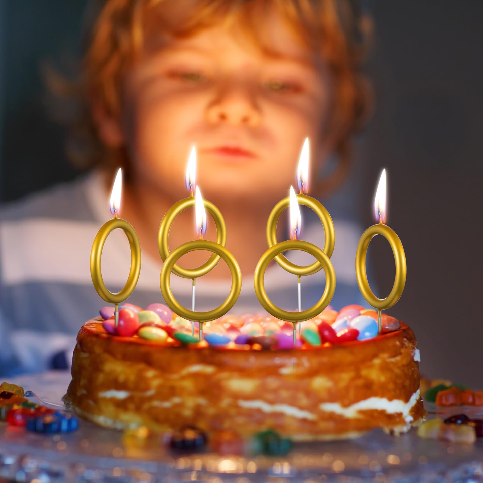 Conelist blue-theme cake decoration enhanced by gold ring candles.