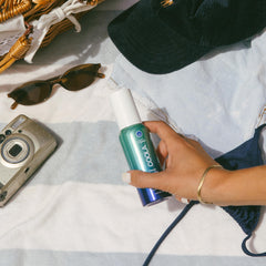 COOLA face mist cap close-up, compact design for on-the-go protection.