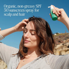 COOLA sun protection mist on hair delivers non-greasy coverage while maintaining style.