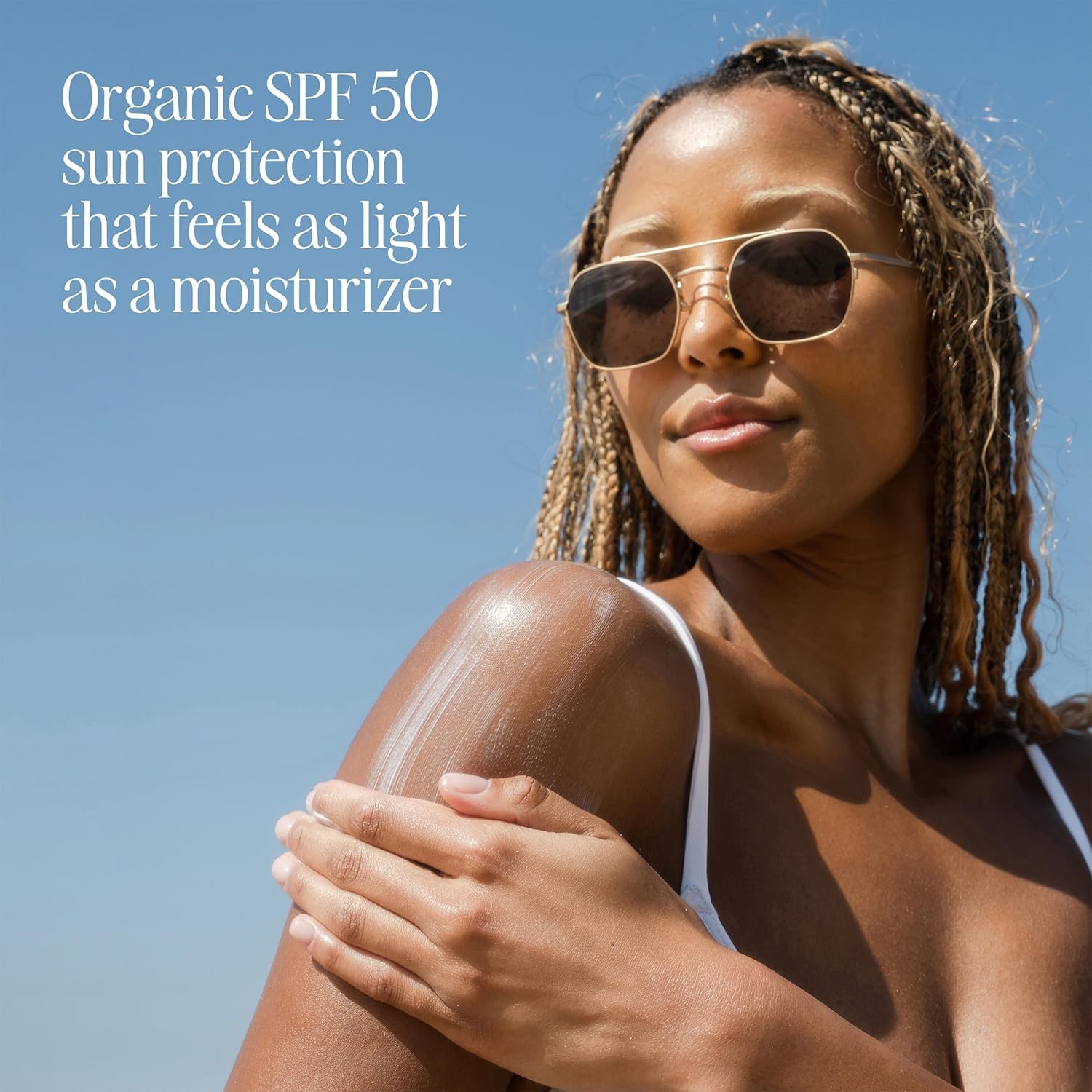 COOLA SPF 50 body lotion applied to arm for easy daily coverage