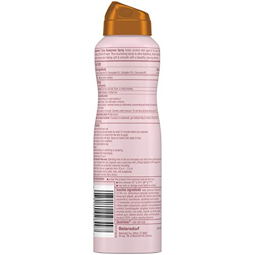 Coppertone Glow spray in hand ready for SPF on the go
