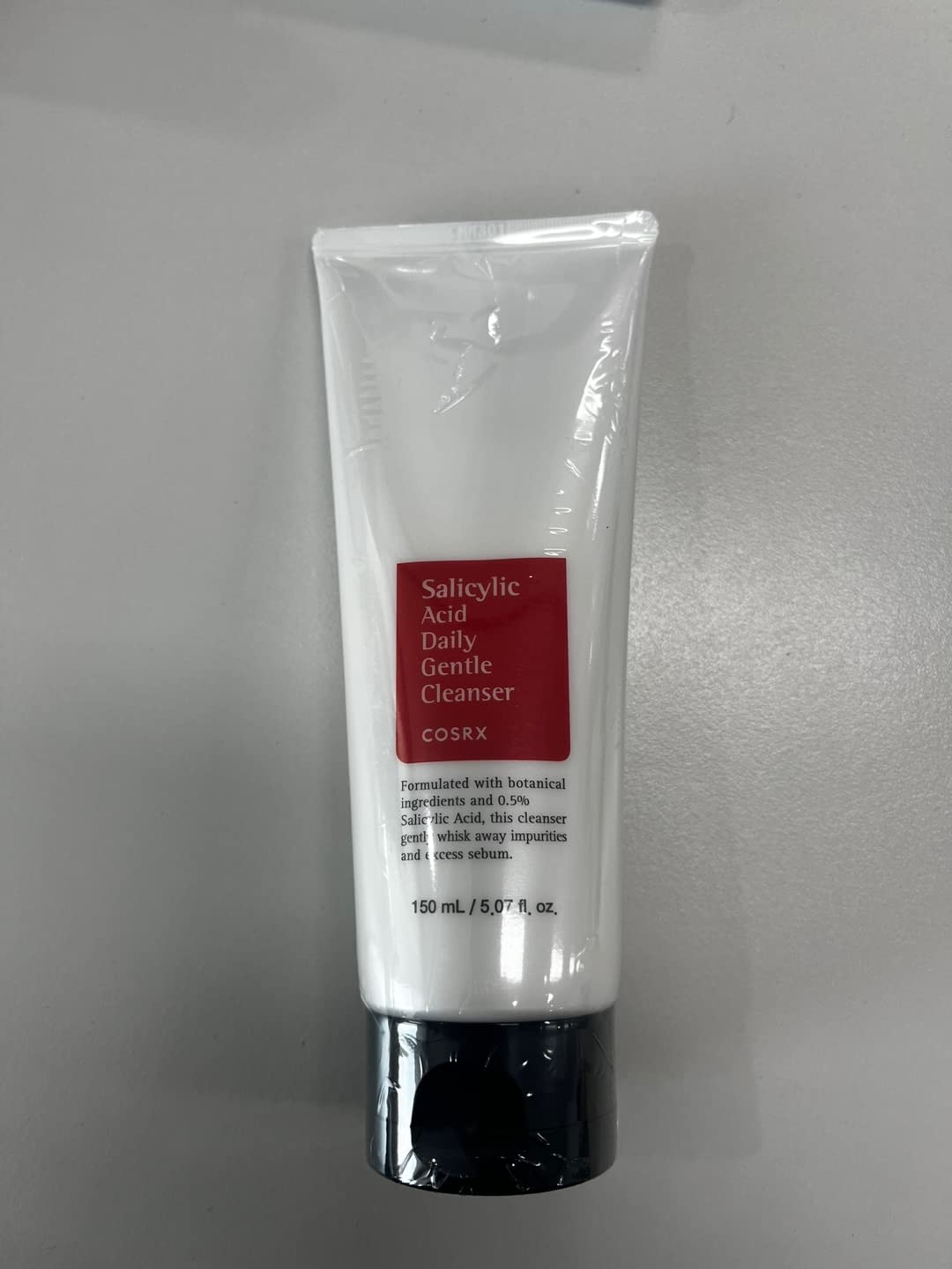 COSRX cleanser foaming lather demonstrates gentle exfoliation for clear pores.