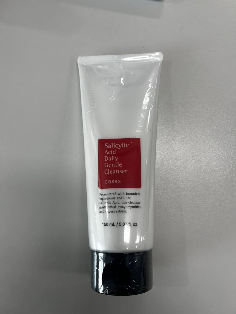 COSRX cleanser foaming lather demonstrates gentle exfoliation for clear pores.