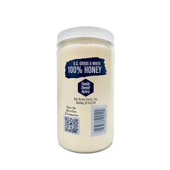 Cox's Honey pure clover honey scoop closeup emphasizing vibrant color and creamy consistency.