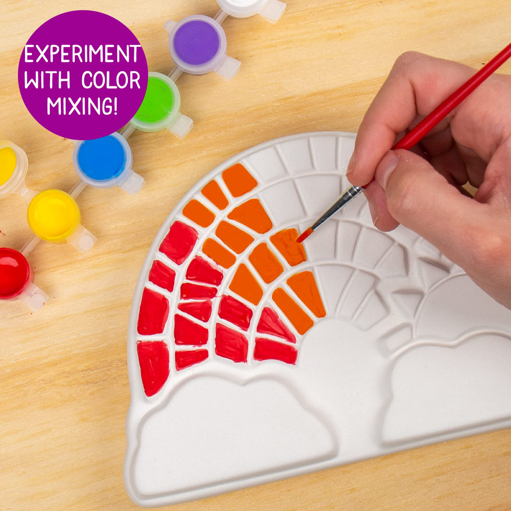Creative Roots color-mixing exploration on stone for vibrant palettes.