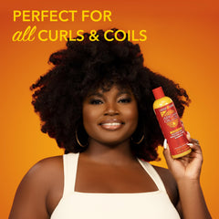 Creme of Nature Argan Oil conditioner application on textured hair for smoother detangling.