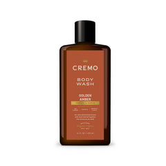 Cremo rich-lather body wash with golden amber bottle for a refreshed cleanse.