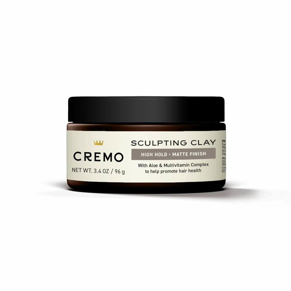Cremo logo with hair clay on shelf indicating premium grooming.