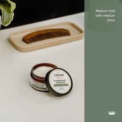 Cremo Hair Styling Cream hand application demonstrates easy rub-in for styling.