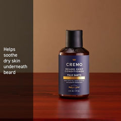 Fragrance swirl over Cremo Palo Santo Beard Deep Conditioner bottle highlighting smoky notes