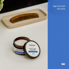 Hands rub Cremo Texture Paste to warm and spread evenly