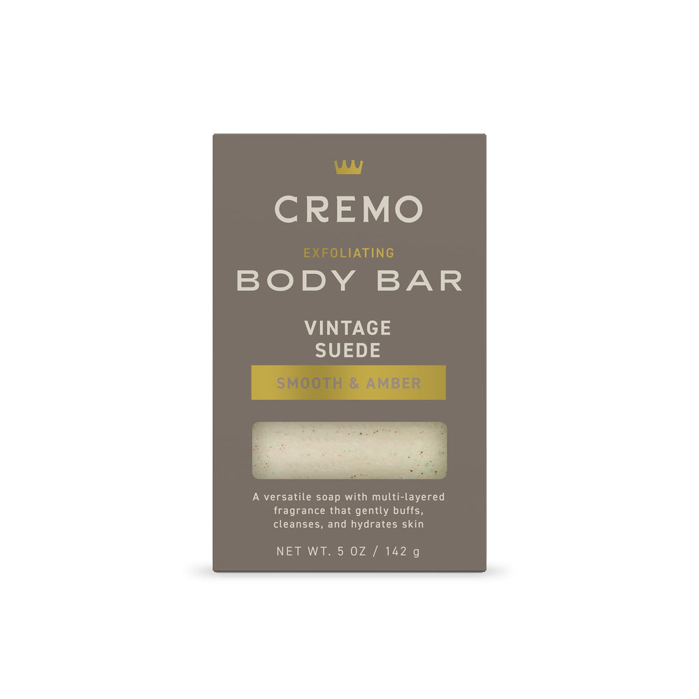 Cremo Vintage Suede Exfoliating Bar front close-up with textured lava rock.