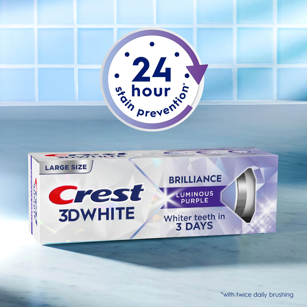 Toothbrush with Crest 3D White Brilliance foam demonstration.