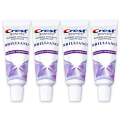 Crest 3D White Brilliance travel-size toothpaste tube for whitening on the go and cavity protection.
