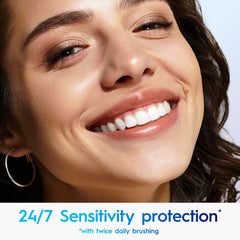 Crest 3DWhite Soft Mint toothpaste being squeezed—demonstrating texture and fresh mint aroma.