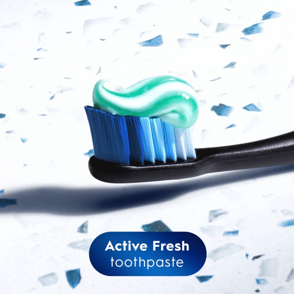 Bright smile close-up after Crest whitening demonstrates surface stain removal.
