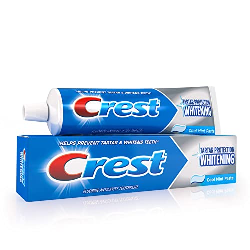 Crest Brushing foam on bristles suggests rich lather during routine.