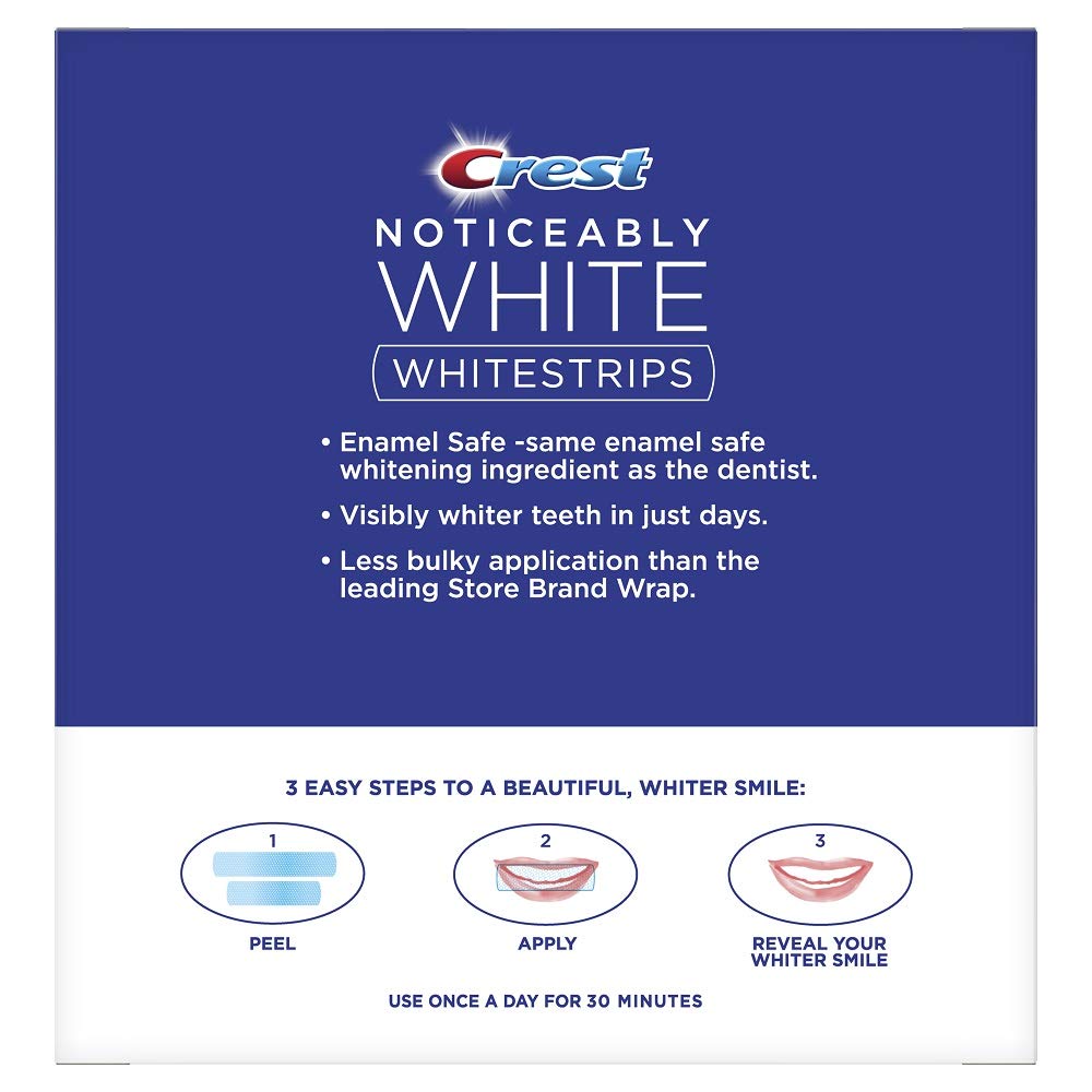 Crest Noticeably White Whitestrips strip aligned on teeth for noticeable whitening