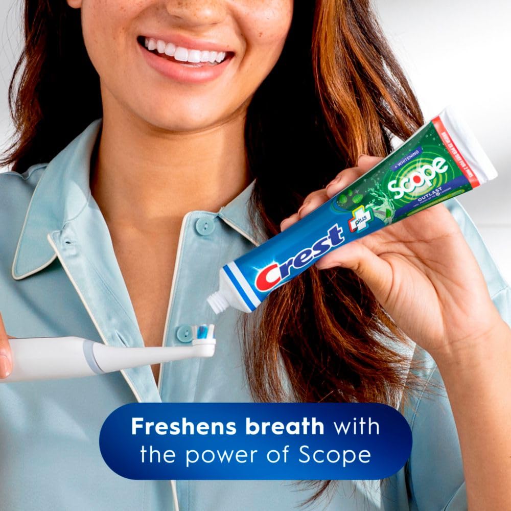Crest triple-pack display with mint branding signals long-lasting freshness during daily use