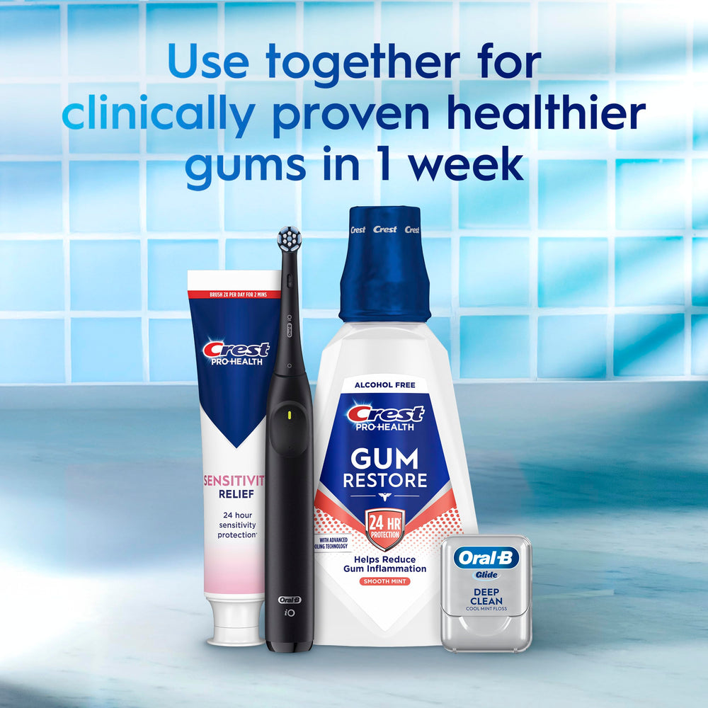 Crest Sensitivity Relief toothpaste being applied to a toothbrush showing easy use.
