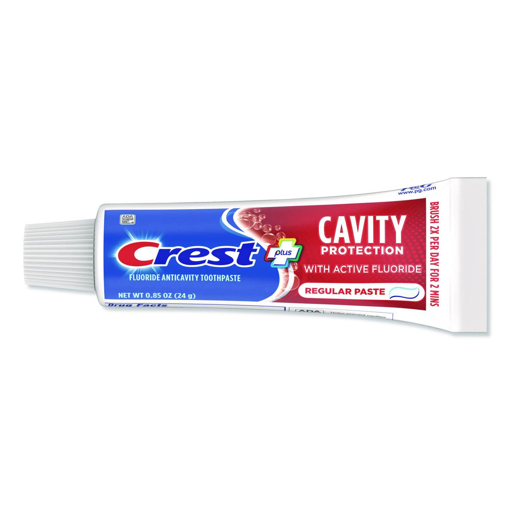 Crest travel-size toothpaste mild mint label signals a gentle flavor for daily use.