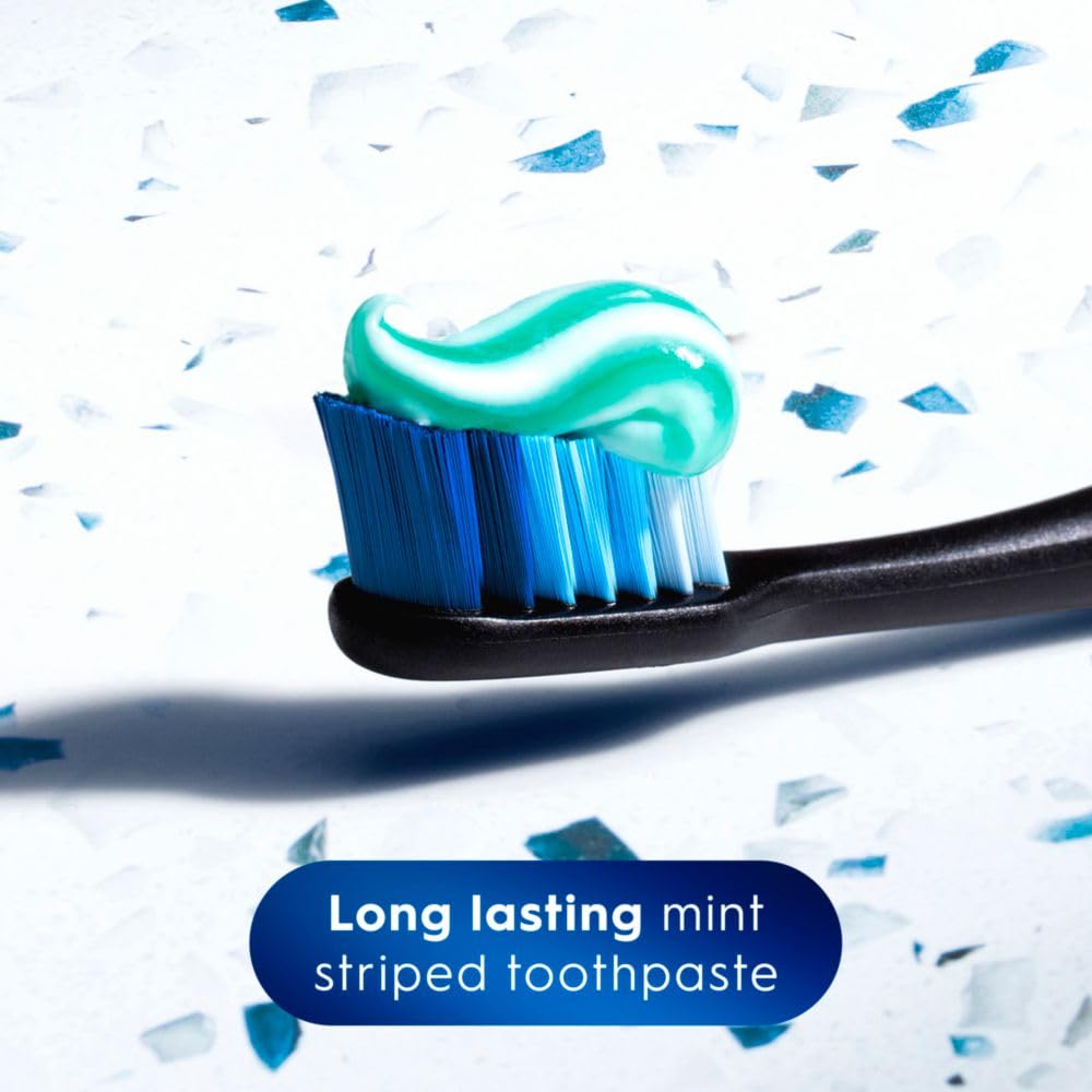 Crest mint-tube on blue background conveys a cool, clean brushing experience