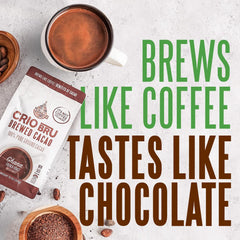 Crio Bru Brewed Cacao Double Chocolate powder near coffee maker signals cocoa aroma and unsweetened flavor.