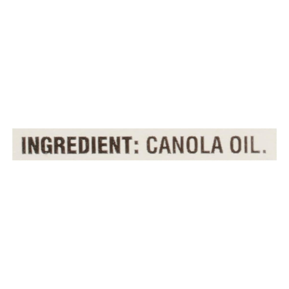 Crisco Pure Canola Oil in cooking pan, ideal for frying and sautéing.