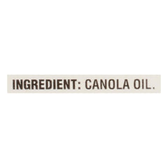 Crisco Pure Canola Oil in cooking pan, ideal for frying and sautéing.