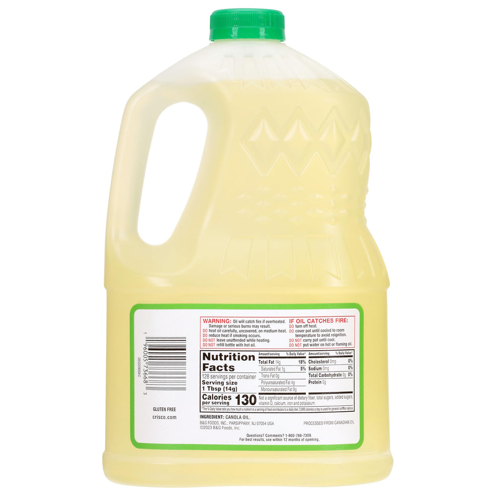 Crisco Pure Canola Oil label closeup shows kosher status and zero trans fat.