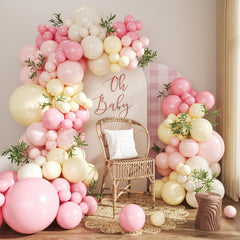 Crossfingers pink and yellow balloon arch kit setup for a stunning event backdrop.