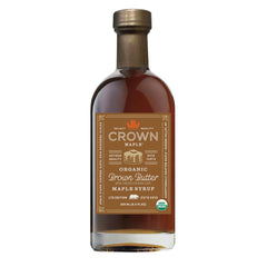 Crown Maple Brown Butter Flavor Syrup bottle pouring over pancakes for indulgent flavor