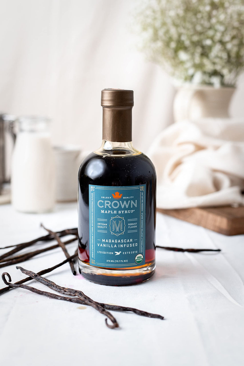 Crown Maple vanilla-infused syrup pancakes brunch scene showcases versatile glaze for morning meals.