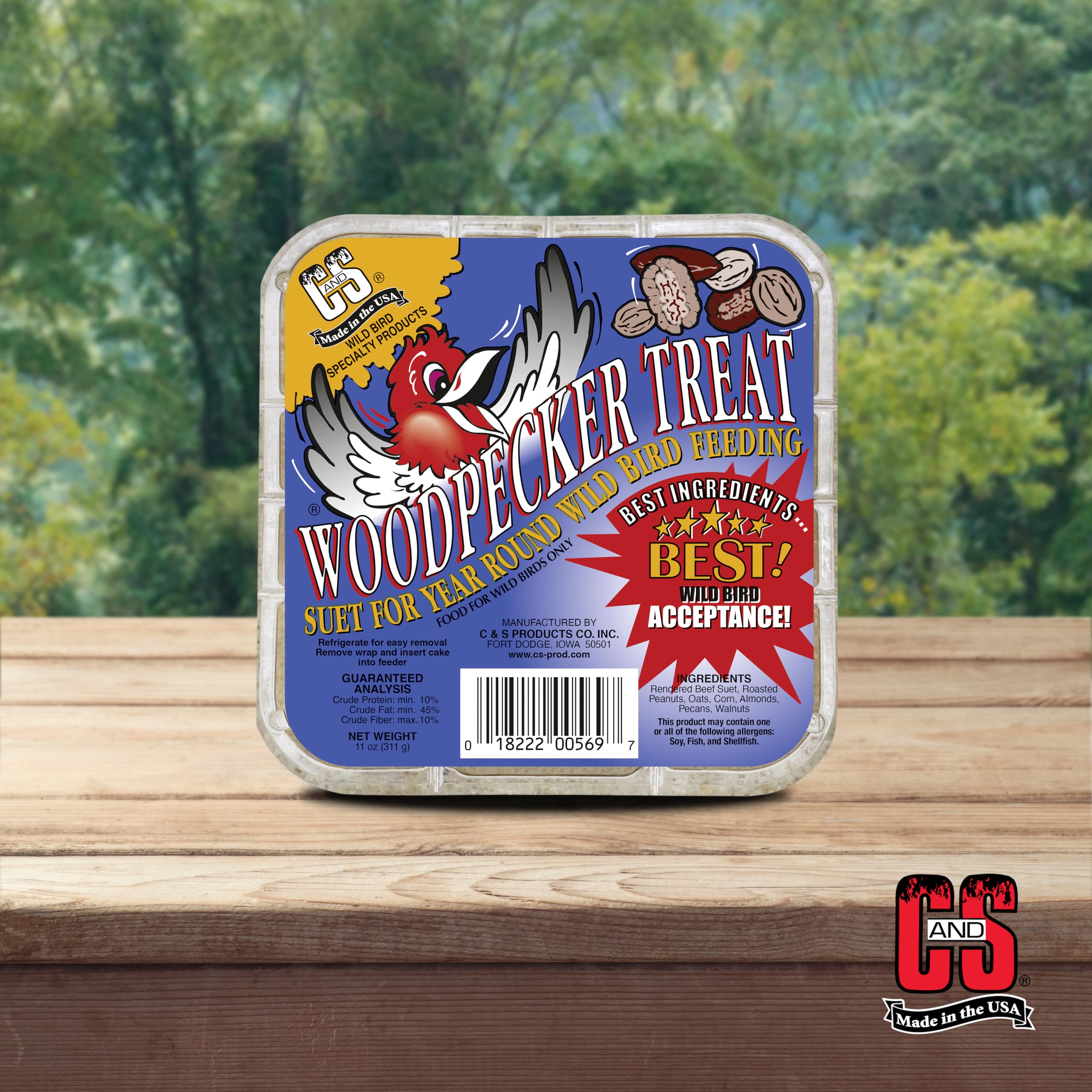Birds flock to C&S Woodpecker Suet Cake in a tree.