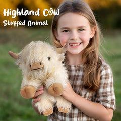 Cuckool Highland Cow plush resting on its belly for easy play and hugs.