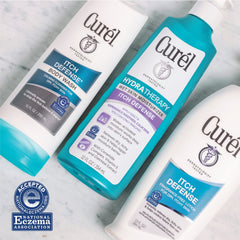 Curel Itch Defense bottle pour, easy-lather cleansing for daily use.