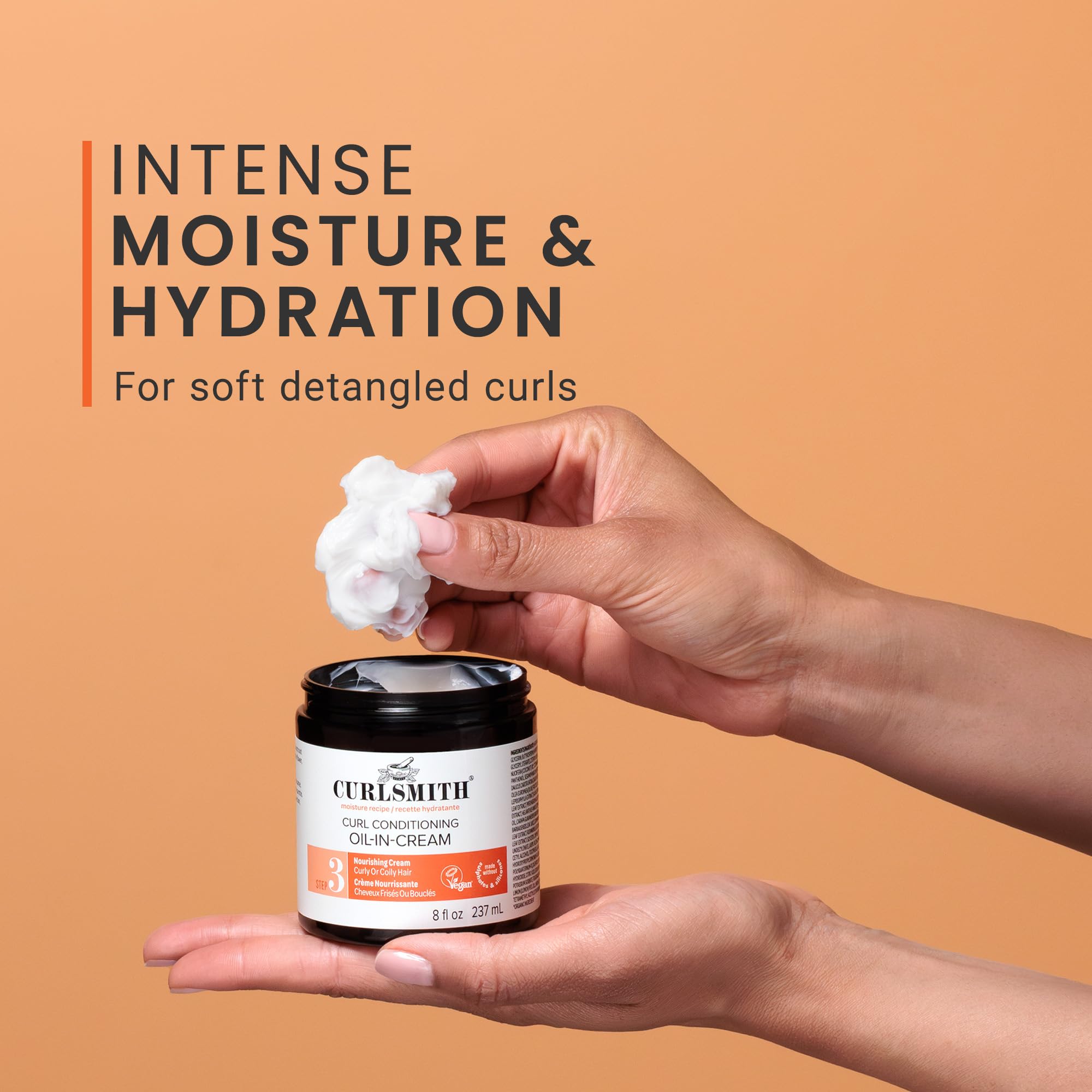 Curlsmith Curl Conditioning Oil in Cream hands demonstrate gentle massage for conditioning