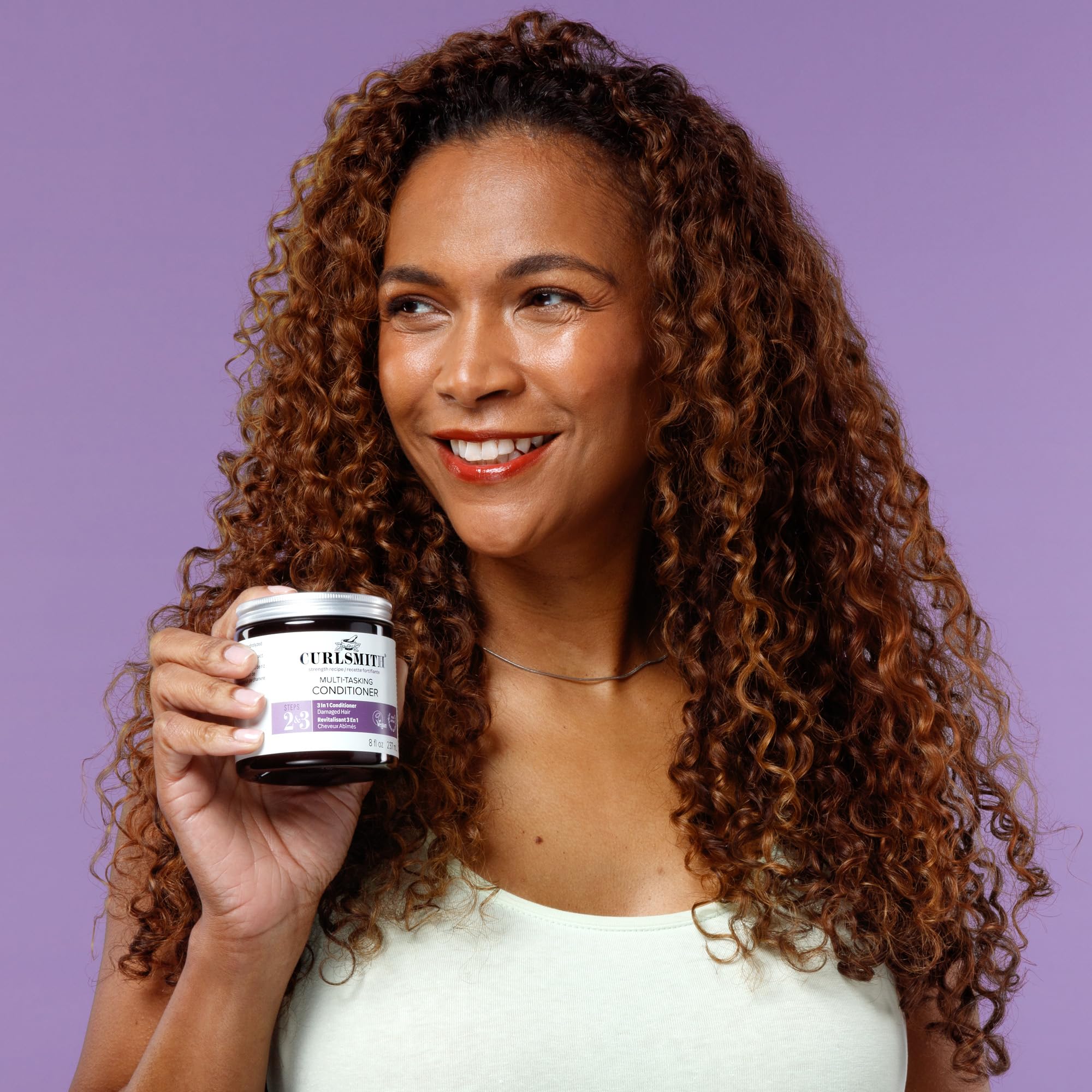 Application on wet hair demonstrates leave-in or rinse-out routine.
